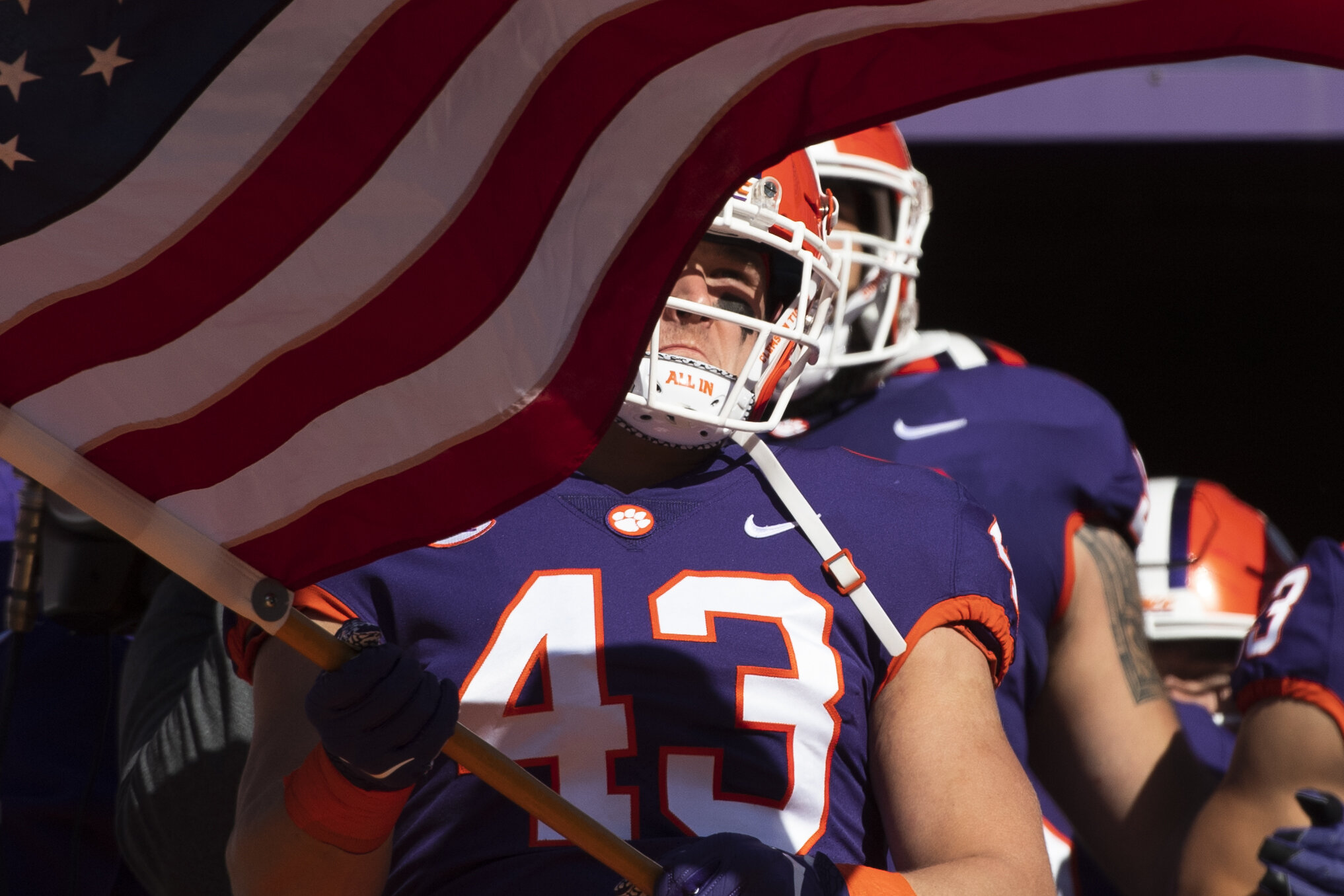  Clemson linebacker Chad Smith (43) carries the United State of America flag before the game against Wofford at Memorial Stadium in Clemson Saturday, November 2, 2019. (The Greenville News) 