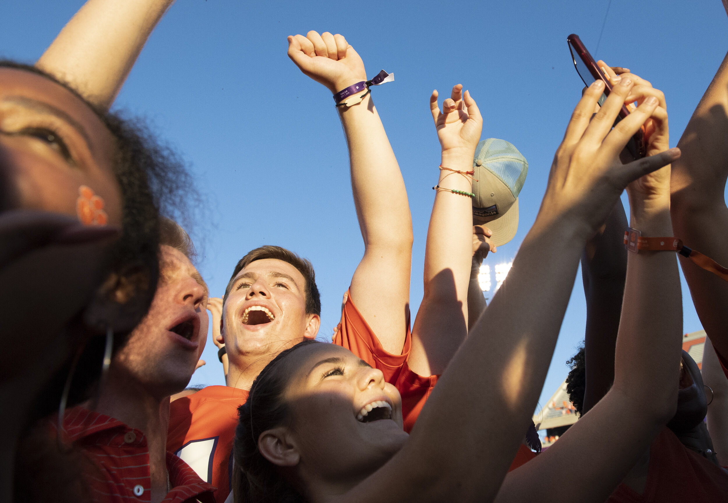  Clemson fans crowd around the team and sing the school song after Clemson won the game against Texas A&amp;M Saturday, Sept. 7, 2019. (The Greenville News) 