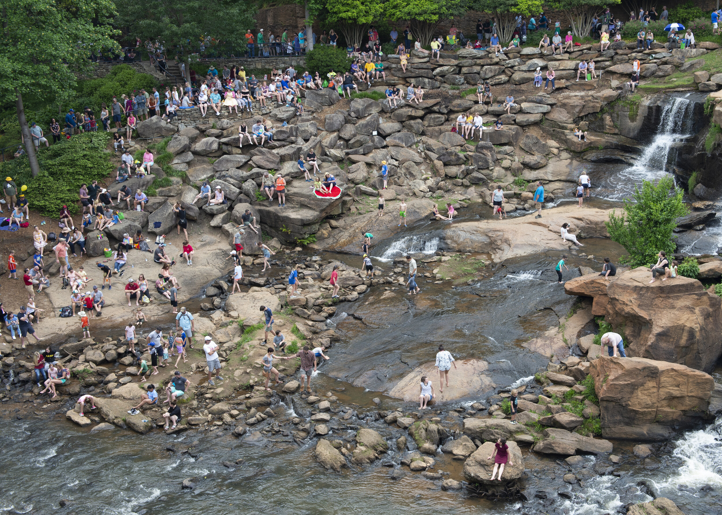  People find spots to watch the 2019 Reddy River Duck Derby in Falls Park on the Reedy Saturday, May 4, 2019. (The Greenville News) 