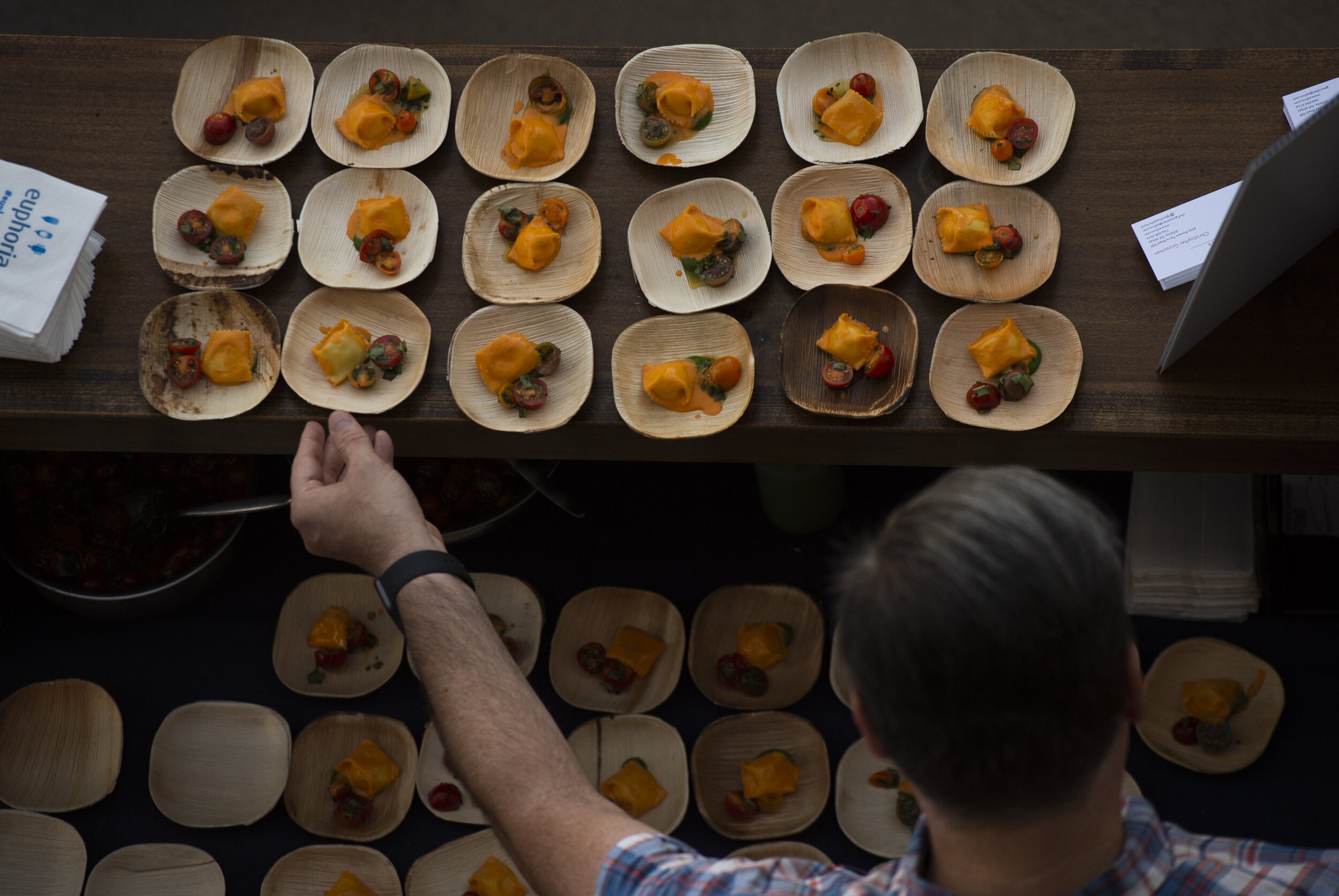  Geno Dew, from ASH Ventures in Atlanta, Ga., places dishes of burrata agnolotti during the euphoria event, "Taste of the South" held at Fluor Field Friday, Sept 20, 2019. (The Greenville News) 