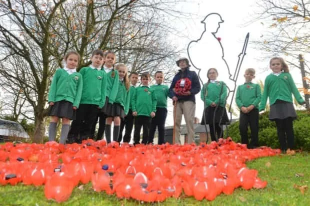 Resident veteran air gunner Tom Douglas alongside West Rainton primary School Children