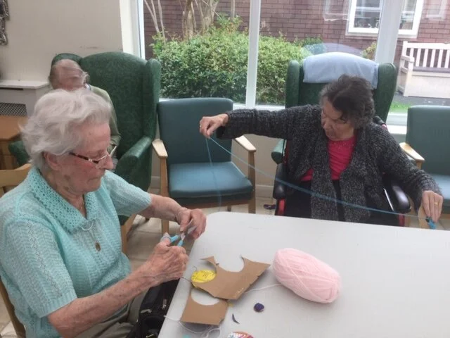 Crafting pom poms at the Gardens