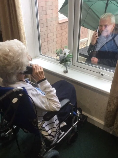 Isobel meeting her son at the window