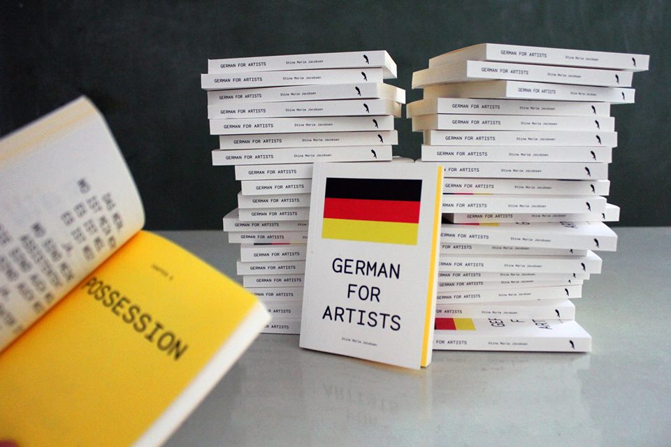 GERMAN FOR ARTISTS Concept: Stine Marie Jacobsen Editor: Ida Bencke Graphic Design: Pieterjan Grandry /modem.ws Soft cover Pages 174 ISBN: 978-3-943196-31-3 September 2015. ENGLISH/GERMAN German for Artists is a hybrid pocket grammar book and an artist's humorous reflections on the more philosophical aspects of the German language. Written by the Danish artist Stine Marie Jacobsen, the book offers a critical and very humorous linguistic introduction to the vibrant and international cultural scene in Berlin. The book looks at contemporary art through the optics of language teaching, educates the reader about art and German grammar at one and the same time. German for Artists offers an insight into the basic German grammar by using well-known people on the international art scene to visualise the rules. The book is designed for artists, curators and other art enthusiasts who dream of learning German. It is an easily portable book offering grammatical first aid and ready-to-use phrases, that will help your understanding of the language in the German art world. A must for all "nicht-so-gut-deutsch" - speaking cultural workers in Germany's capital! The book offers advice to help art people in different typical social and practical situations in the Berlin art world. Stine Marie Jacobsen (b. 1977), is a conceptual artist working to decode individual and collective violence through participatory means. Focusing on language, gender and psychology, she uses film as a starting point to create performative experiments and platforms for new ways of looking at ethics, identity, fear and trust. She lives and works in Copenhagen and Berlin, graduated from the Royal Danish Academy of Fine Arts with an MFA and a BFA from CalArts, the California Institute of the Arts, Los Angeles, USA. Some of her notable solo shows have been at Künstlerhaus Bethanien, 2012, Berlin, Kohinoor, 2010, Copenhagen, District Kunst- und Kulturförderung, 2014, Berlin, Galway Arts Center, 2014, Galway, Ireland and Overgaden institute of contemporary art, 2015, Copenhagen, Denmark. Selected group shows consist of Six Impossible Things Before Breakfast, Momentum Biennale 2013, Moss, Norway, Either Or Nikolaj Kunsthal, 2013, Copenhagen, Idyll Turku Biennale, Turku, Finland, The 10th OPEN International Performance Festival, 2009, Beijing. In order to give participants a collaborative and dialogical space, Stine creates open structured sociocultural and participatory projects with clearly defined themes. With a focus in themes such as film, language, gender, violence, death, taboos, anonymity, psychology, the artist conducts performative experiments and creates platforms for critical thinking and new ways of looking at ethics, identity, control, fear and trust. Over the years Stine has conceptualised and worked on a number of participatory projects that are within these parameters, like for example Direct Approach, where participants are asked to retell their most violent film scene memory and choose whether they would play victim, perpetrator or bystander and why. Stine has organised and facilitated many Direct Approach workshops in Germany, Ireland, Colombia and Denmark. In 2014 the project was a 6 month workshop at District Kunst- und Kulturförderung in Berlin in collaboration with social work organisations Gangway and Streetcollege and was jury selected for Berlin Art Week. Another example is Mann beißt Hund (a remake of the Belgian film C’est arrivé près de chez vous), without actors. Alongside the use of film as a law system, with lawyers the artist also organised court cases with teenagers, where real lawsuits were rejudged and in workshops rights in private and public space were reflected on and discussed. In 2015, Stine was awarded an innovative educational grant from Node curatorial studies in Berlin and in 2016 she will receive a peace fellowship and professional Conflict Resolution certificate from the Rotary Club.