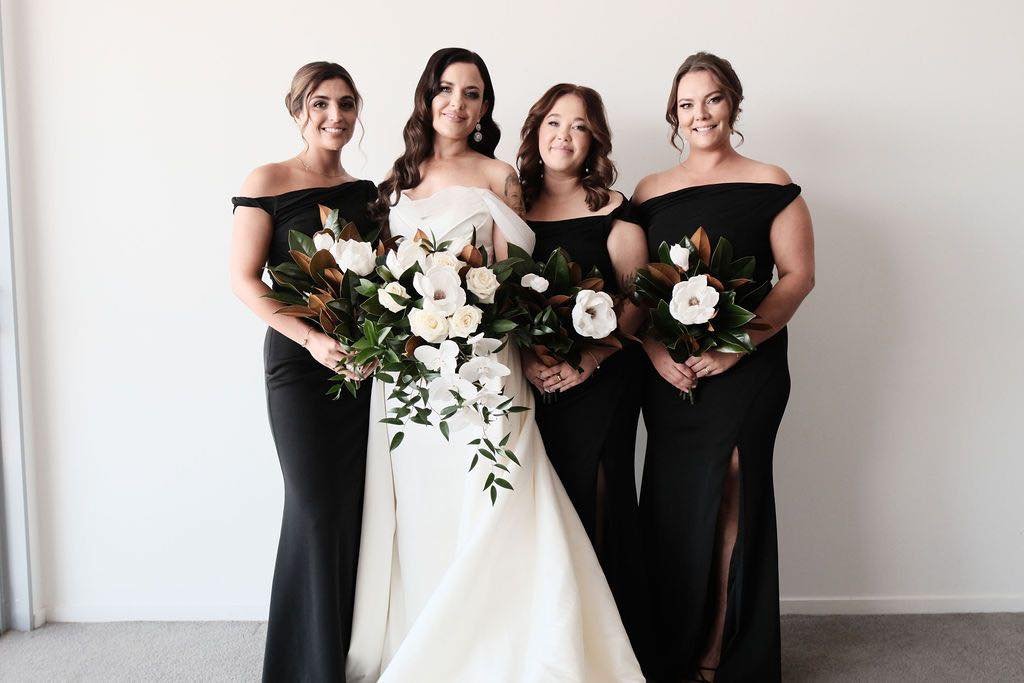 When love is in the air, flowers become even more magical!

We had the pleasure of creating these stunning bouquets for Tennille and her beautiful bridal party. The combination of the black dresses and classic white flowers is simply perfect for a ro