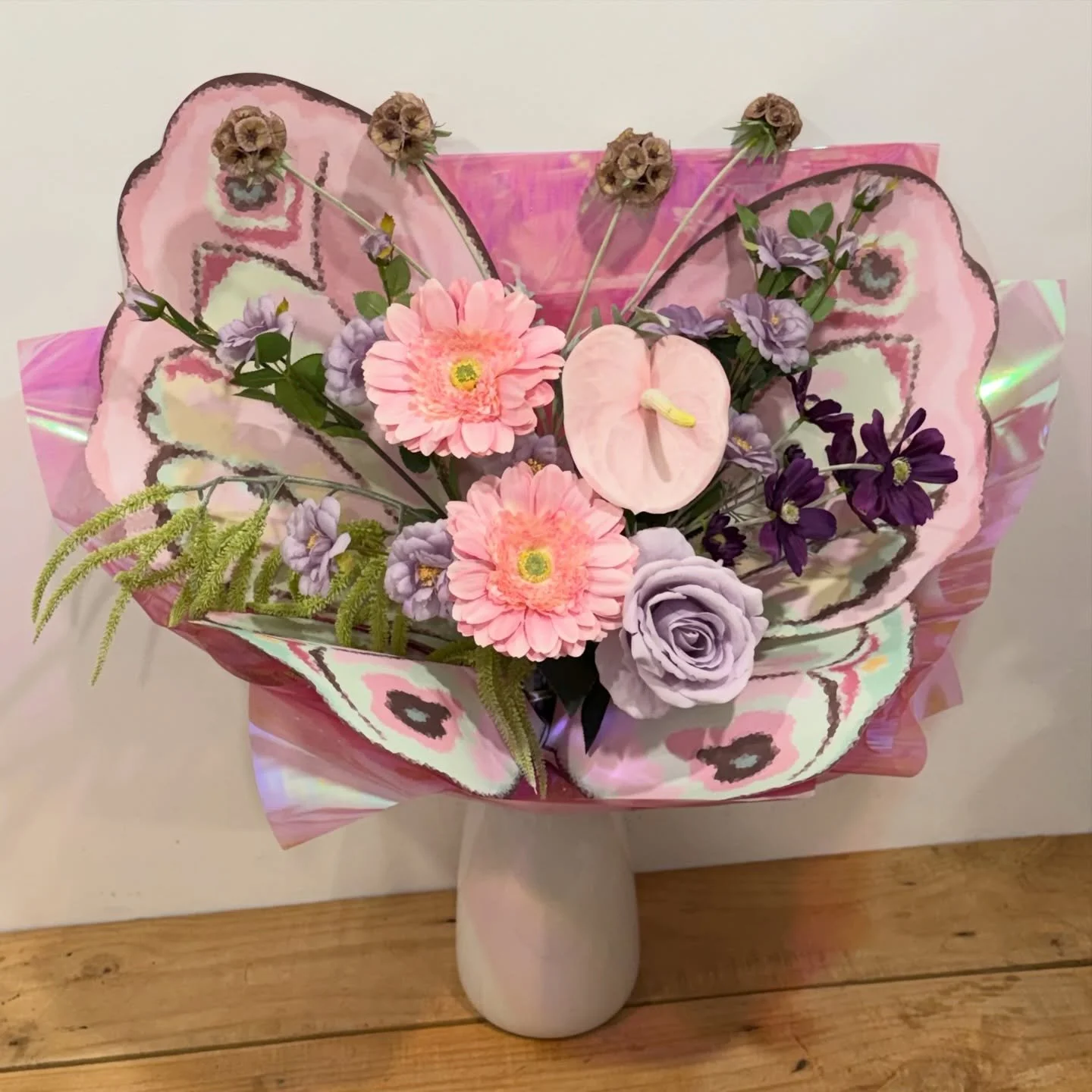 Bring a little magic indoors with our Artificial Butterfly Blooms &mdash; where florals meet whimsy. 

Delicately crafted petals are paired with soft, fluttering butterfly wings, creating a statement piece that feels both enchanting and effortless. 
