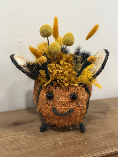 Bee Preserved Arrangement in Rattan Planter