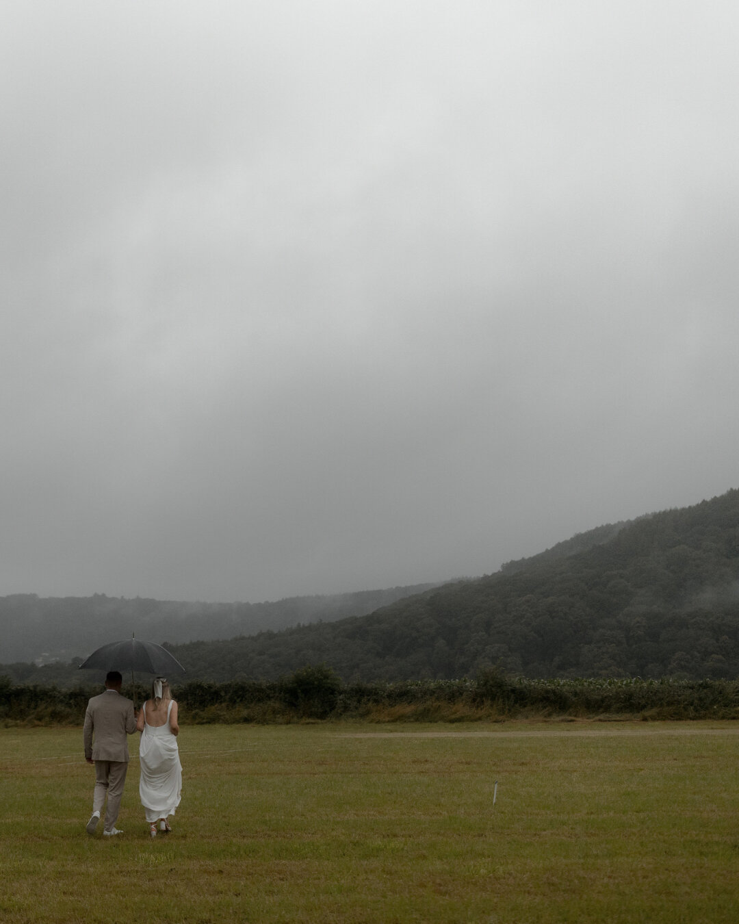 One thing we can always say is that the weather is predictably unpredictable and expecting rain is part of planning an English wedding! Thankfully, Emma &amp; Kai fully embraced the rain regardless of their plans for an outdoor festival wedding in th