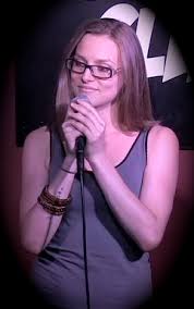 Stand-up comic and author Katie Schreiber doesn't tell three-person jokes. All the more reason to catch one of her sets in New York City. Image via ktschreib.com .