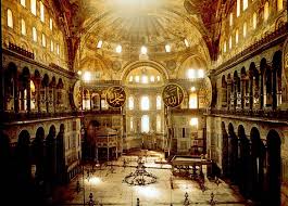 At left, the narthex at Hagia Sophia, and above, the vast room awaiting inside. Images via orthodoxartsjournal.org and openbuildings.com .