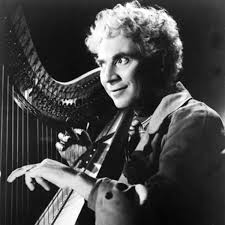 Harpo Marx. Image via biography.com .