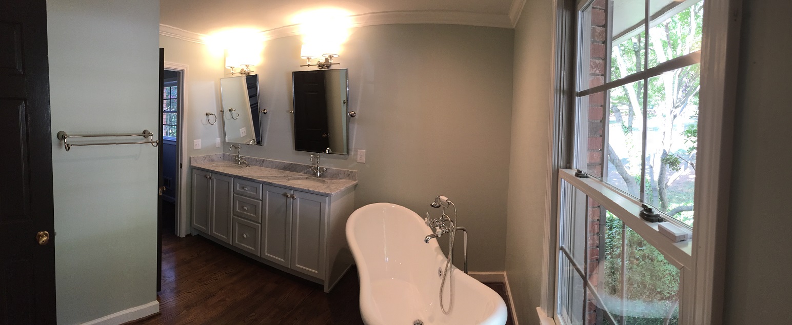  The master bath also has a freestanding tub and a custom vanity with a marble countertop 