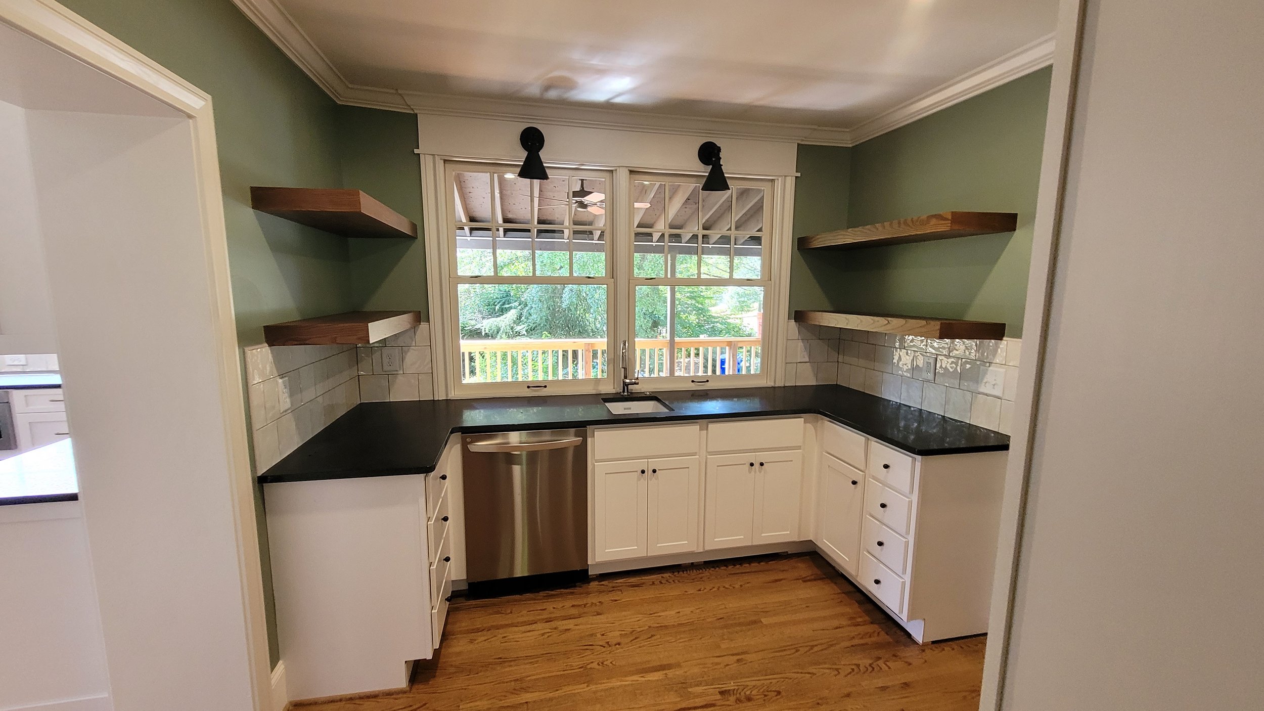  The original butler’s pantry was reworked and connects to the new dining room and has a pass-through window to the back deck 