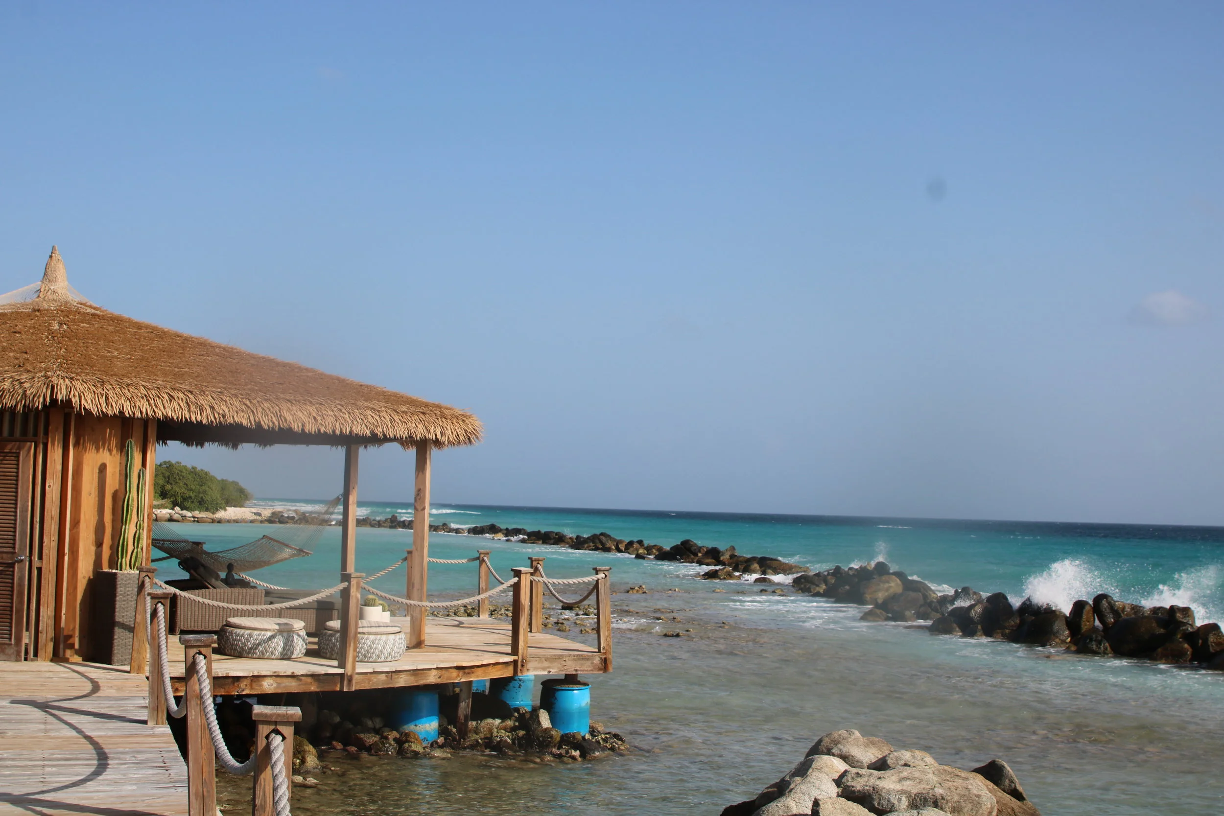 On the end of the peninsula separating the two beaches is the spa cove. { Photo Credit Jacob K . }