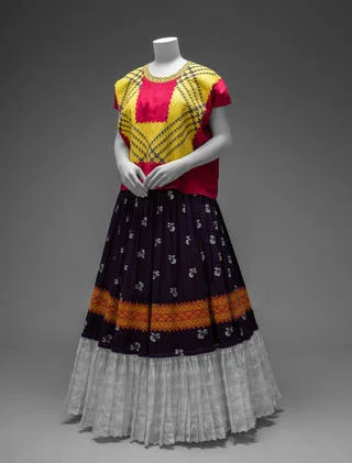 Cotton huipil with machine-embroidered chain stitch; printed cotton skirt with embroidery and holán (ruffle). Museo Frida Kahlo. Diego Rivera and Frida Kahlo Archives, Banco de México, Fiduciary of the Trust of the Diego Rivera and Frida Kahlo Museums