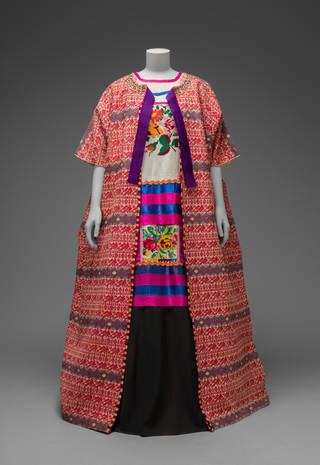 Guatemalan cotton coat worn with Mazatec huipil and plain floor-length skirt. Museo Frida Kahlo. © Diego Rivera and Frida Kahlo Archives, Banco de México, Fiduciary of the Trust of the Diego Rivera and Frida Kahlo Museums