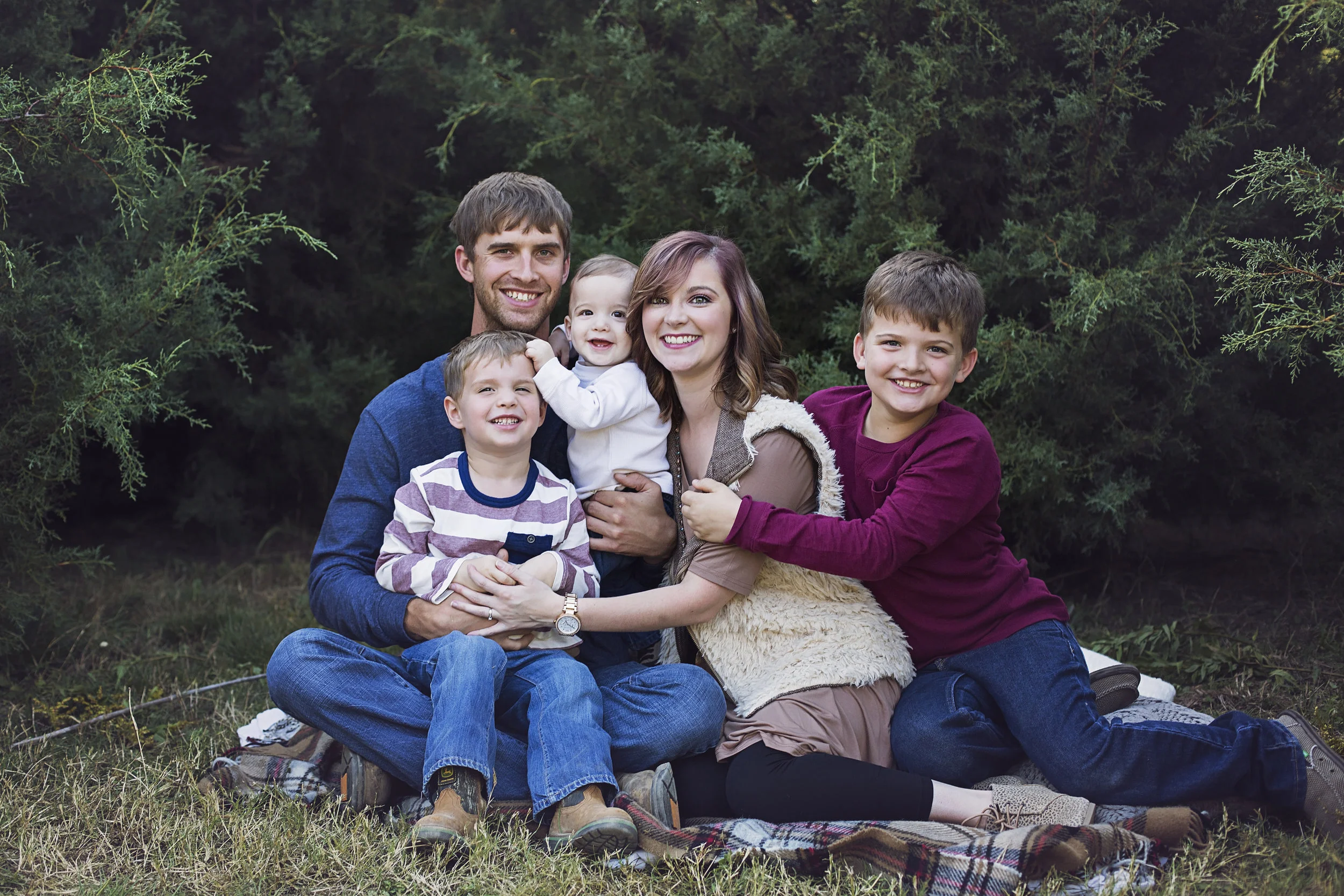 "Lindsey did an awesome job capturing my family!! I have a 10 month old and she did great keeping his attention and keeping him smiling! I love all of the images from our session. It's going to be hard to pick which ones I want for our Christmas card!! " - Hope Sorrells