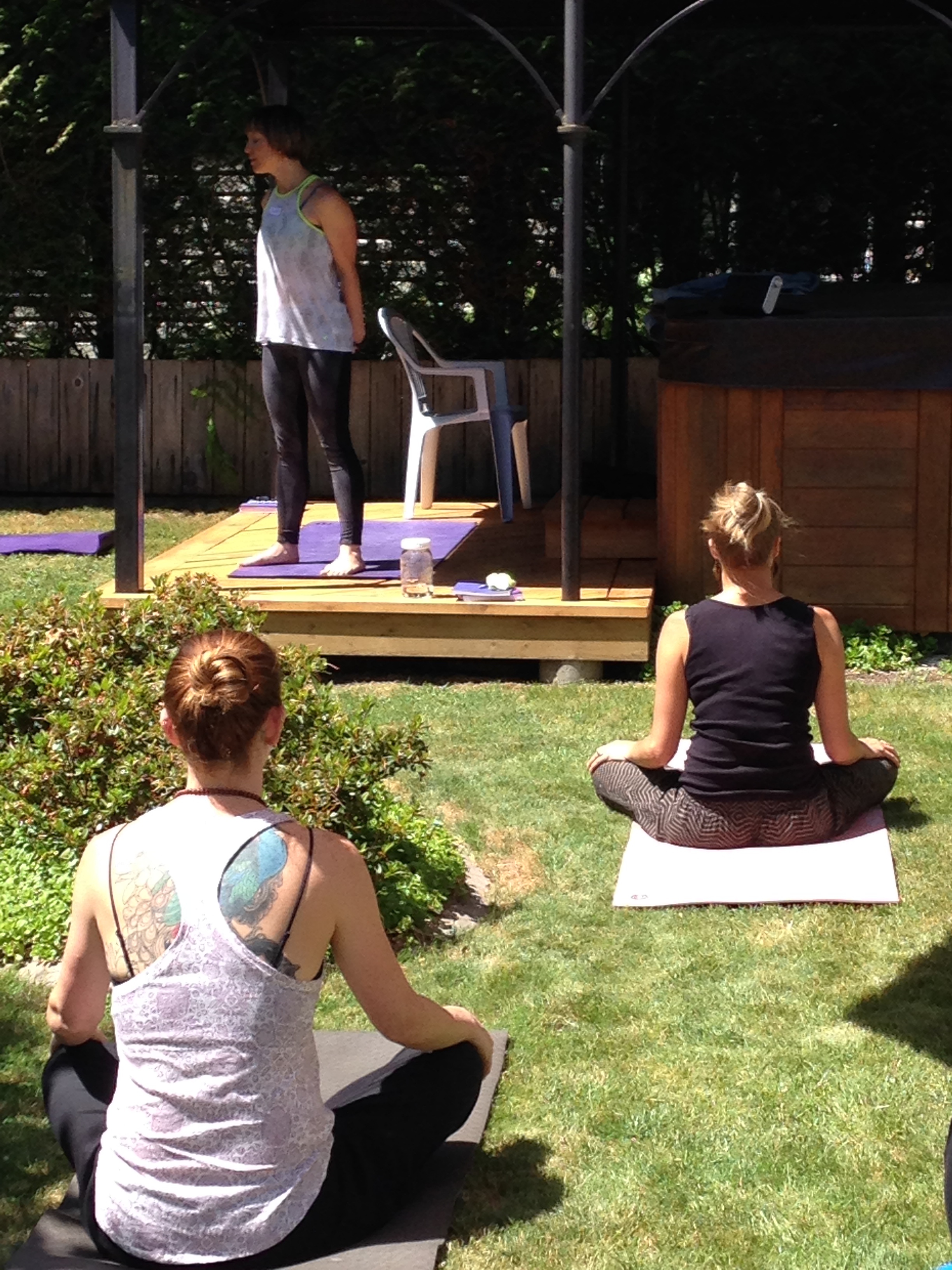 Relaxing yoga outside let by Brandi Matheson