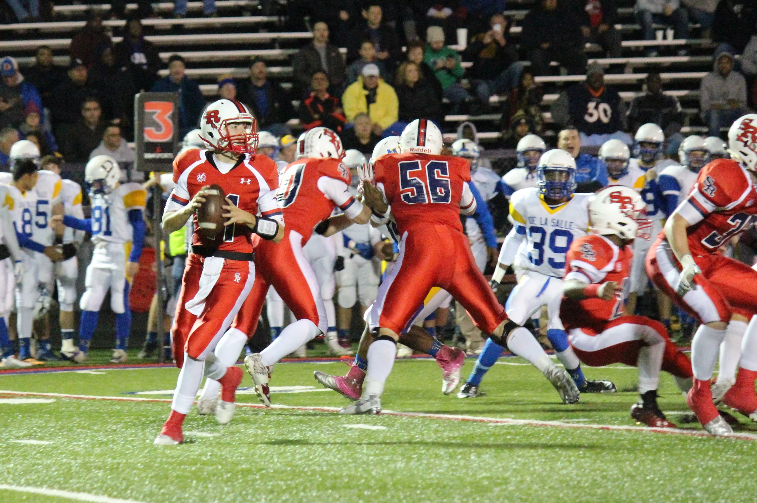 St. Rita quarterback junior Connor Kelly (#11, St. Barnabas) and senior offensive lineman Drew Walega (#56, St. Christina)