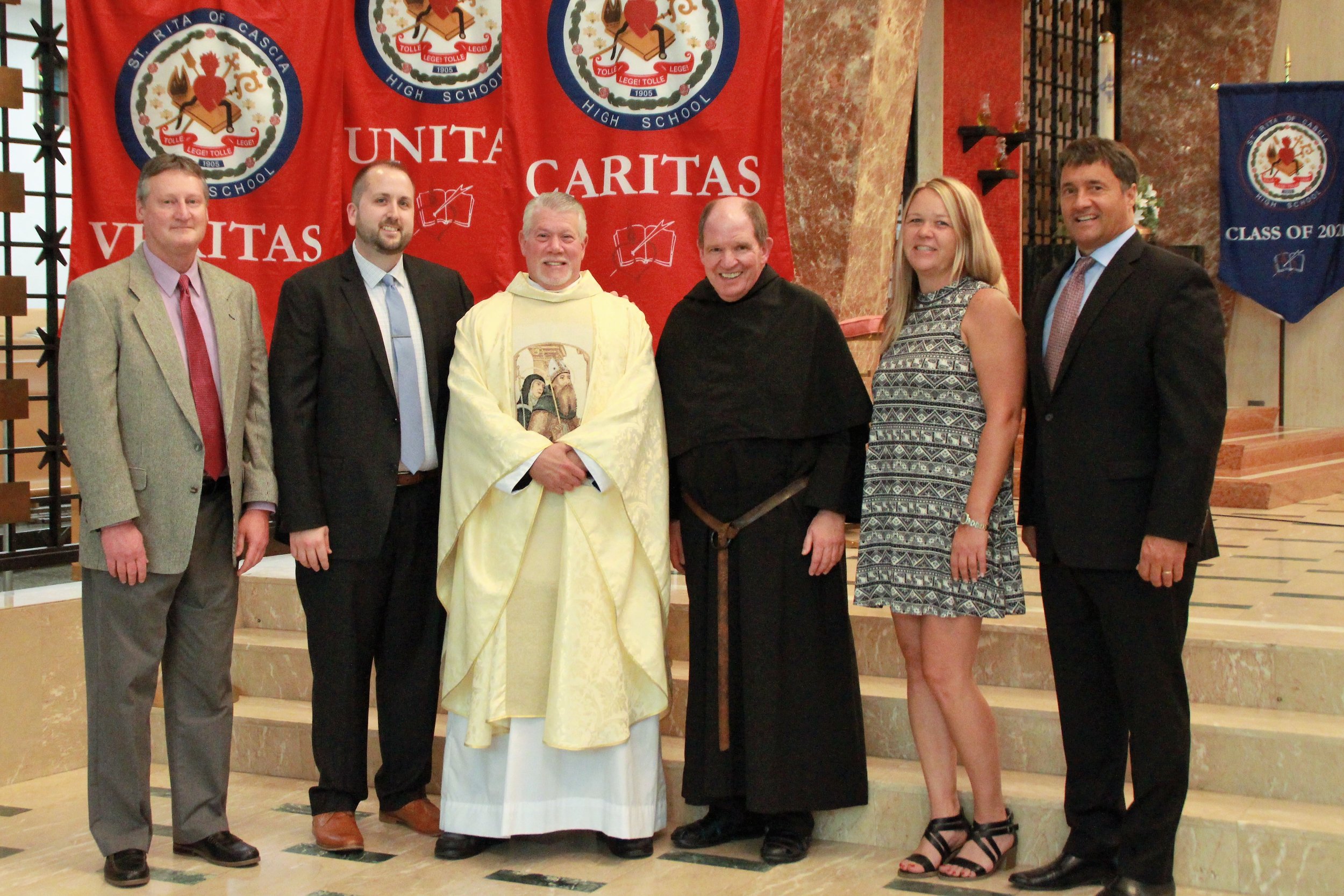 St. Rita Administration (L to R): Mr. Wes Benak, '81, Dean of Academics; Mr. Josh Blaszak '02, Dean of Student Leadership; Fr. Anthony Pizzo, O.S.A., Prior Provincial of the Midwest Augustinians, Fr. Paul Galetto, O.S.A., Ph.D., Head of School, Ms. Eileen Spulak, Chief Financial Officer, Mr. Mike Zunica, President