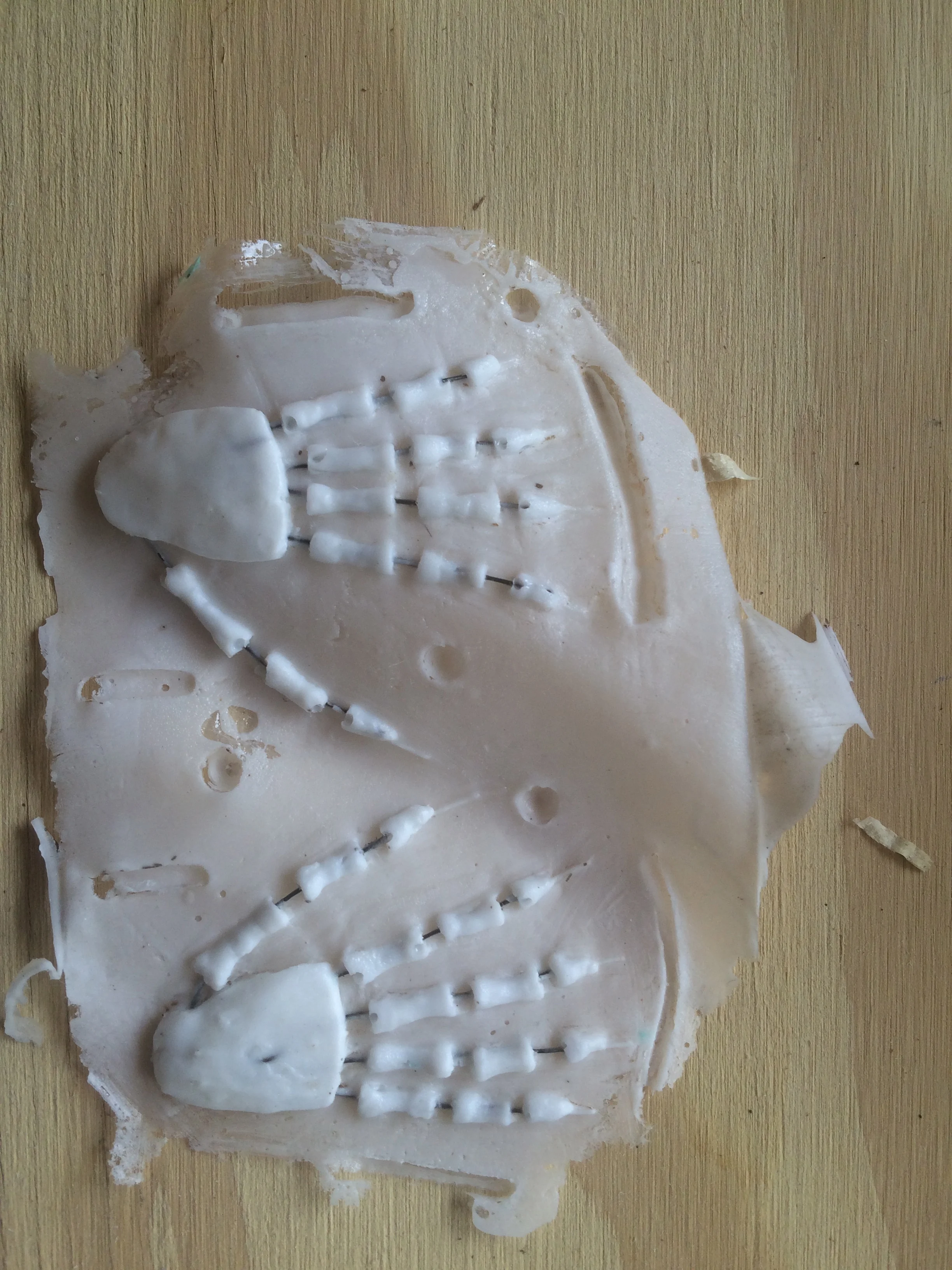 Successfully cast hands with small wires laid into the fingers for joint articulation