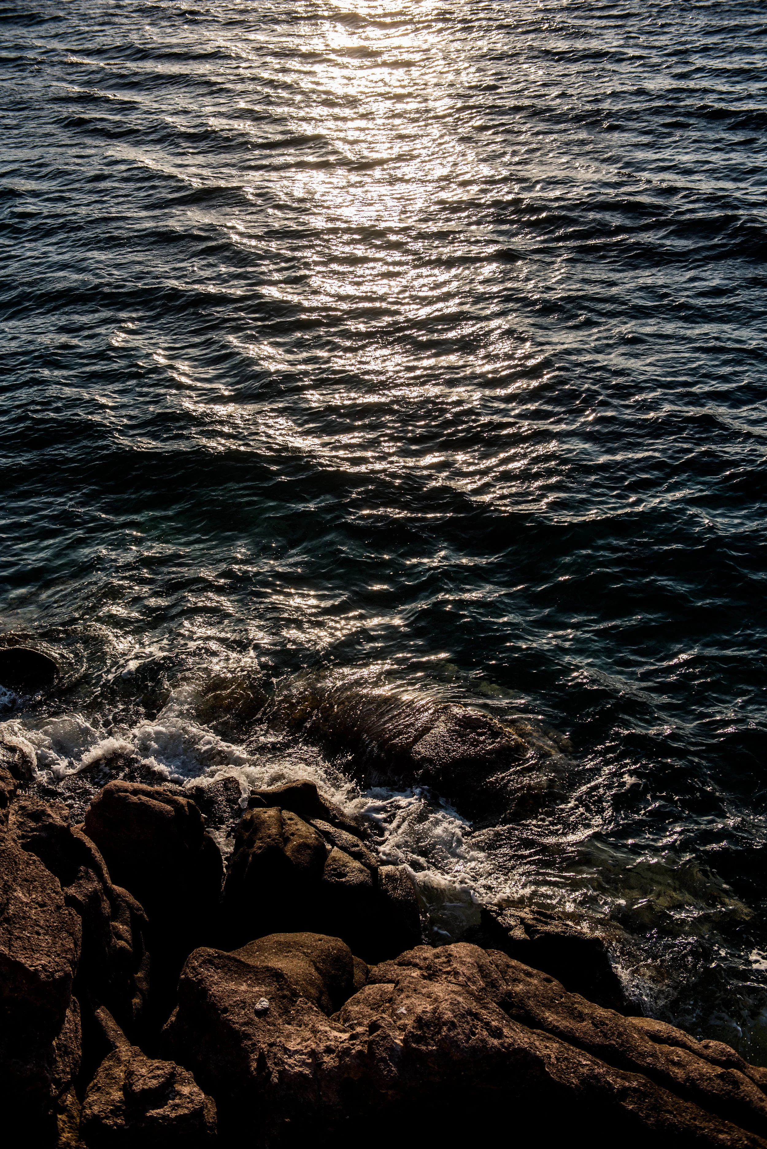 The sun sets on the Aegean Sea outside of Skala port