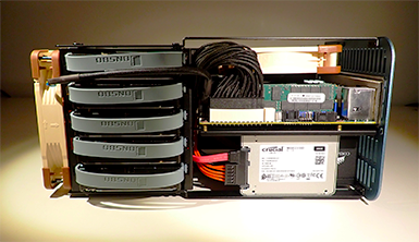 Internal 3.5" Hard Drives cooled by a Noctua 140mm fan.