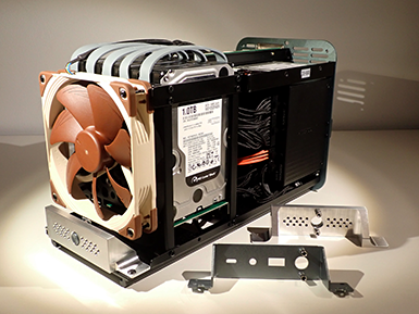 Custom fabricated fan bracket to cool Mini-ITX motherboard.