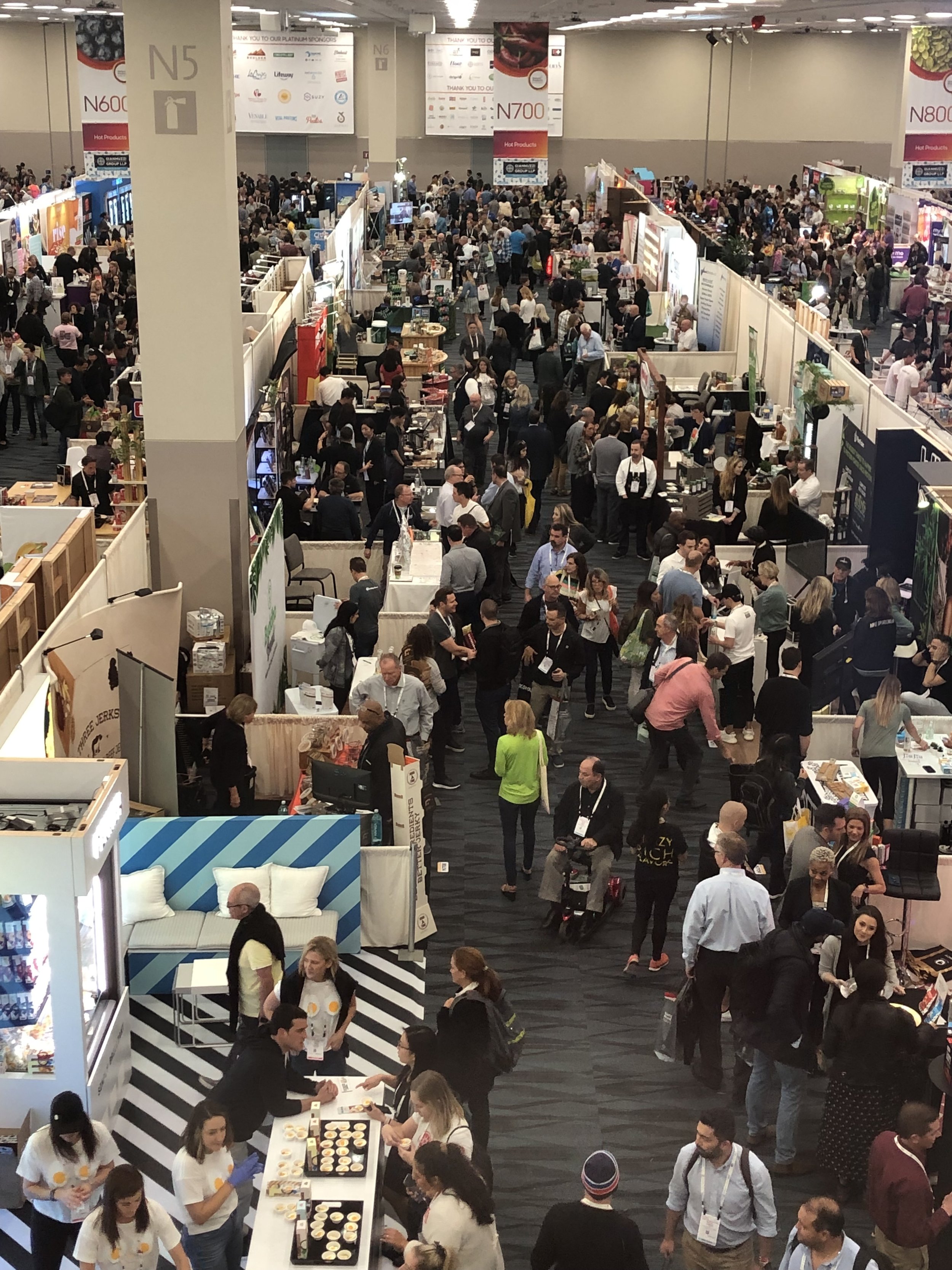 I tried, I really tried to see all the food booths over 3 days but sadly, I did not make it. Given the sheer size, all the samples to taste and so many great entrepreneurs to meet, it would have taken over 60 hours to see all the booths, even briefly. There were 13 different show floor spaces filled to capacity with extraordinary new products. You can see one such aisle overlooking the first floor of the North Hall!