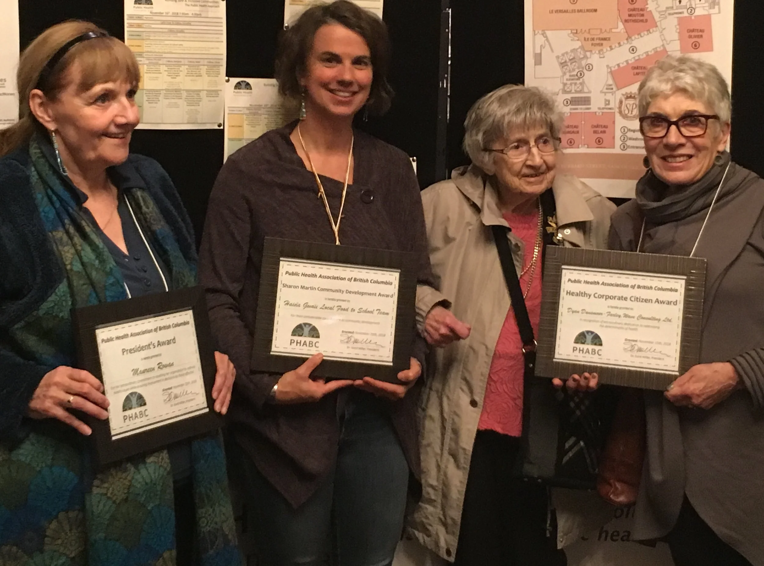 2018 PHABC Award winners (from left to right): Maureen Rowan from PHABC received the President’s Award; Shelley Crack, community nutritionist and community capacity builder from Haida Gwaii received the Sharon Martin Community Development Award; 103-yr old Bertha Loewen received the Phyllis M. Baird Memorial Award for her lengthy service as a public health nurse in BC; Dyan Dunsmoor-Farley, Managing Director of Wave Consulting, received the Healthy Corporate Citizen Award for her extraordinary dedication to addressing the determinants of health; and Dr. James Frankish (missing from photo) received the Award of Merit for his prolific research and promotion of healthy Canadians.
