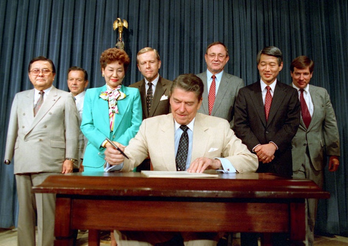 President Reagan signing the 1988 Civil Liberties Act.
