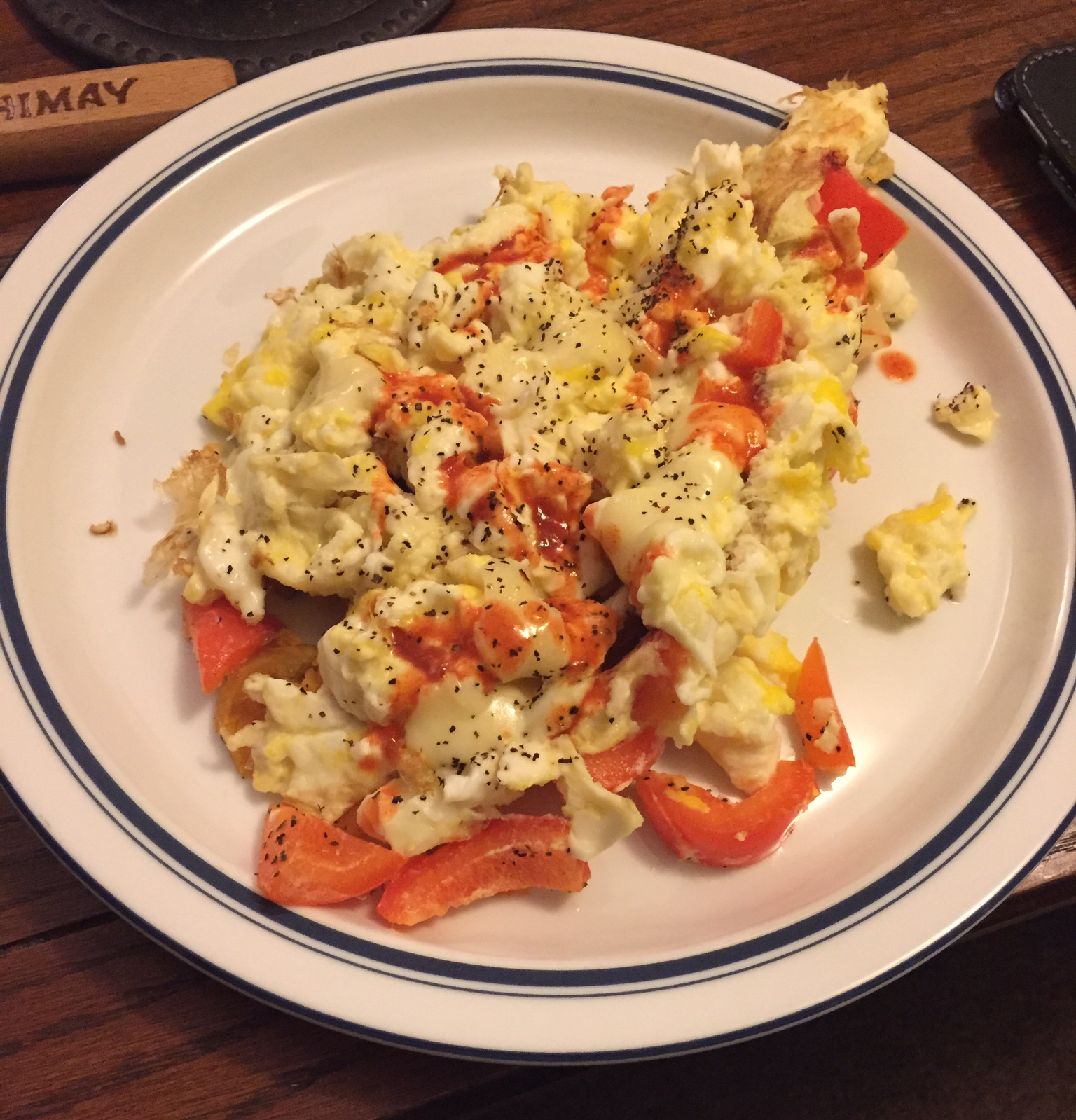 Here is the finished product - whole eggs, egg whites, sliced red pepper, black pepper, 1 slice of deli provolone and some hot sauce! 