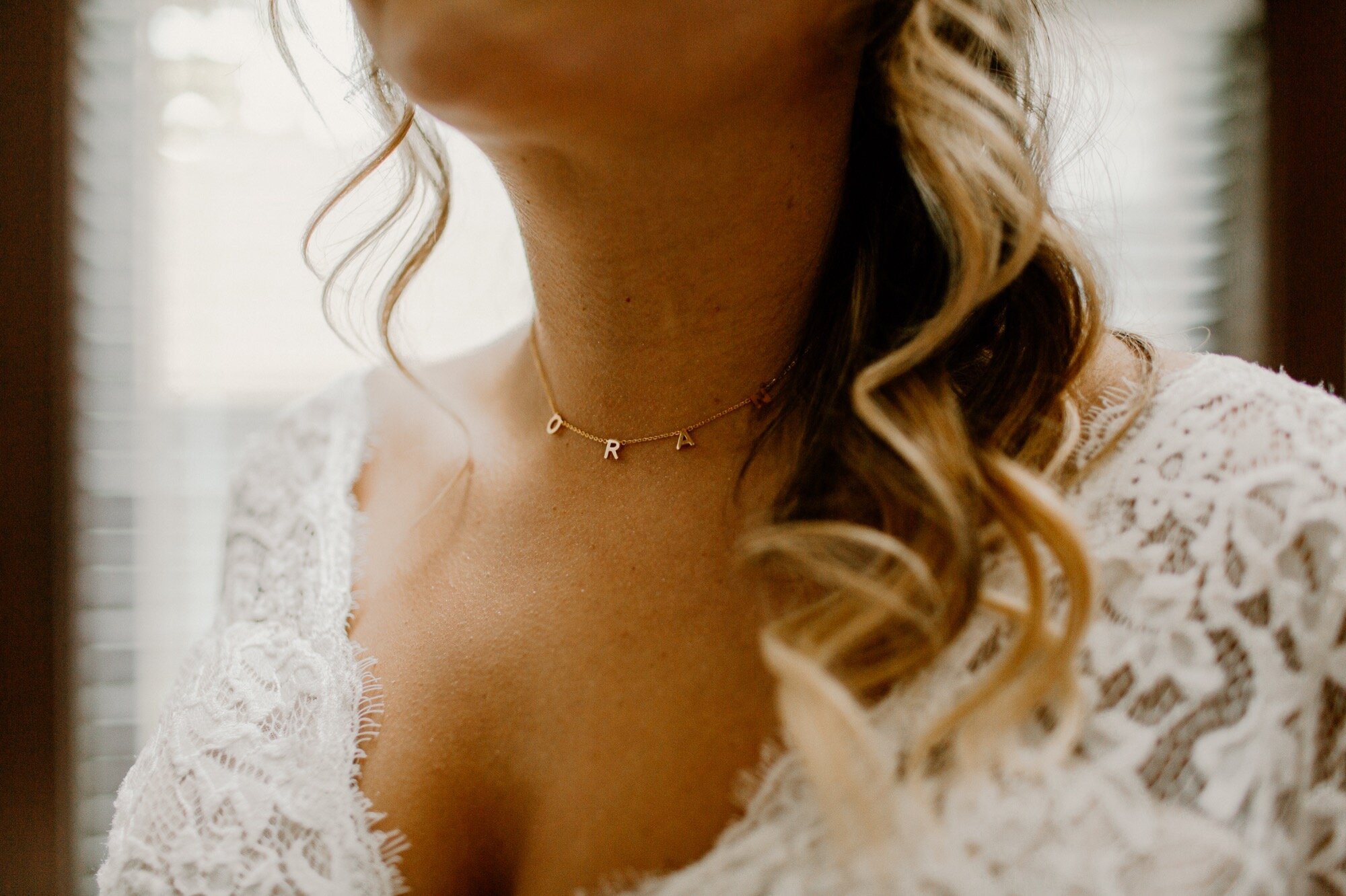 03_ginapaulson_anabellaed_elopement-83_Bride Necklace Detail.jpg