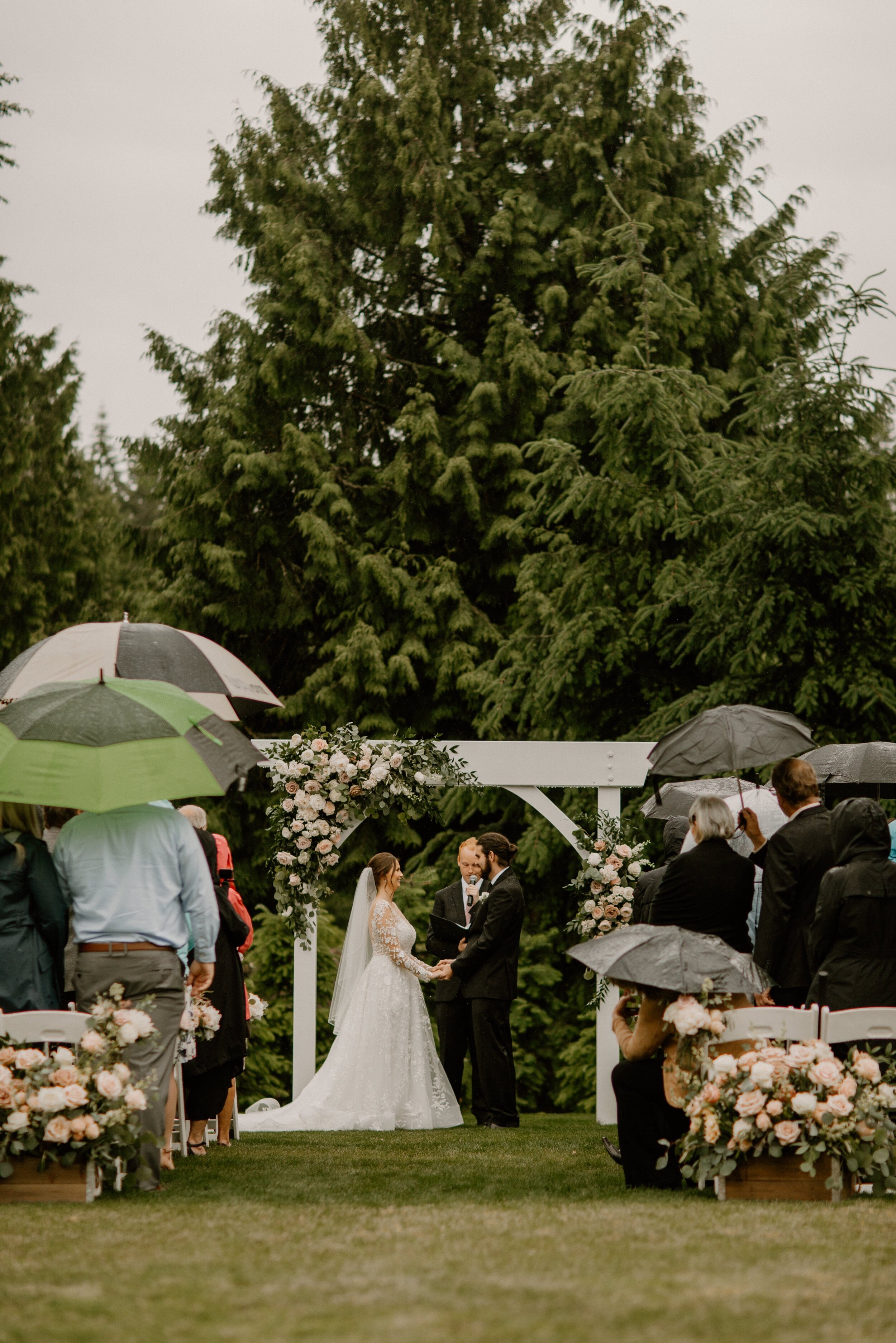 24_ginapaulson_seanandkellewedding-818_Wedding in the Rain.jpg