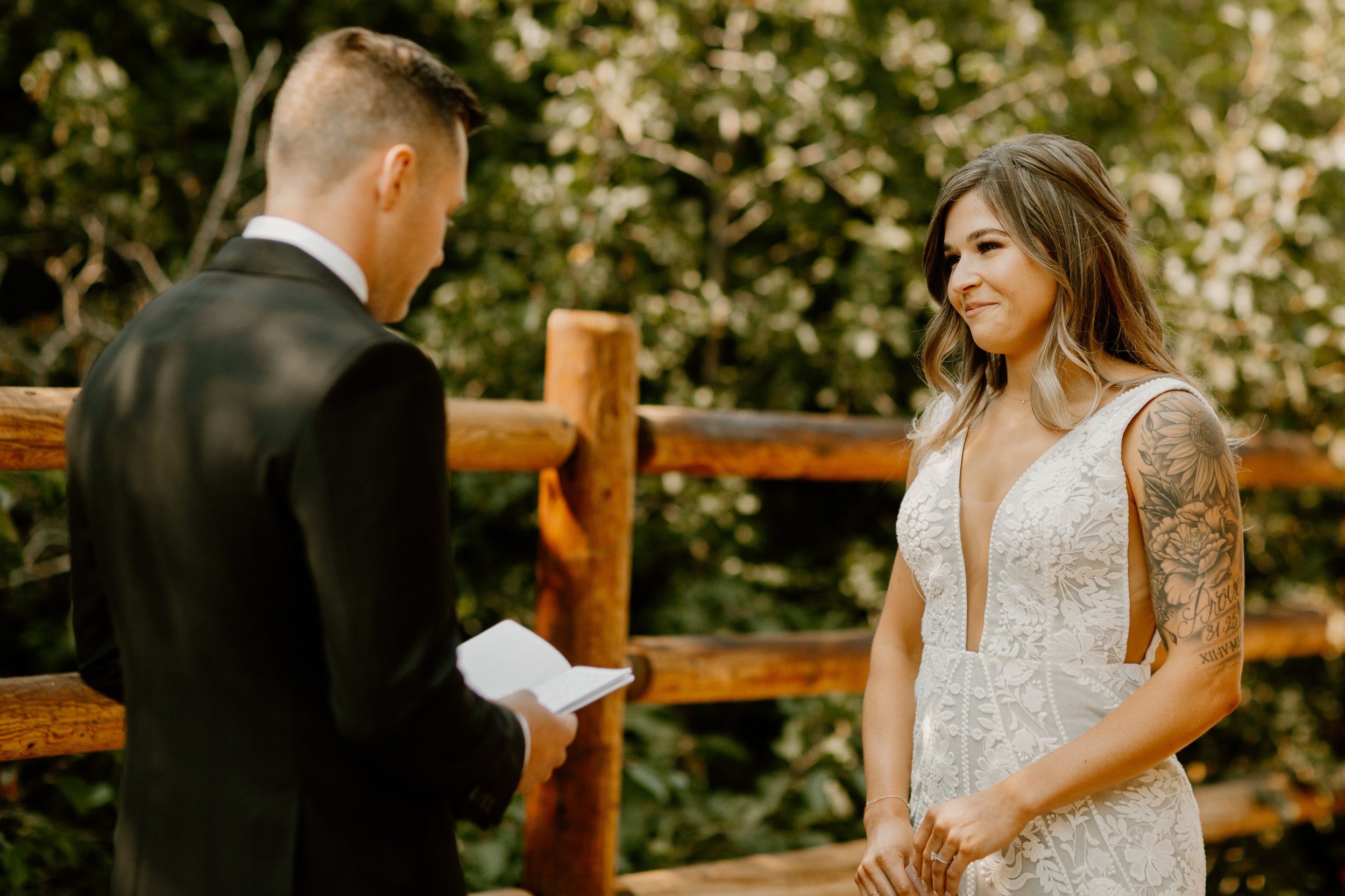 Groom reading private vows to bride