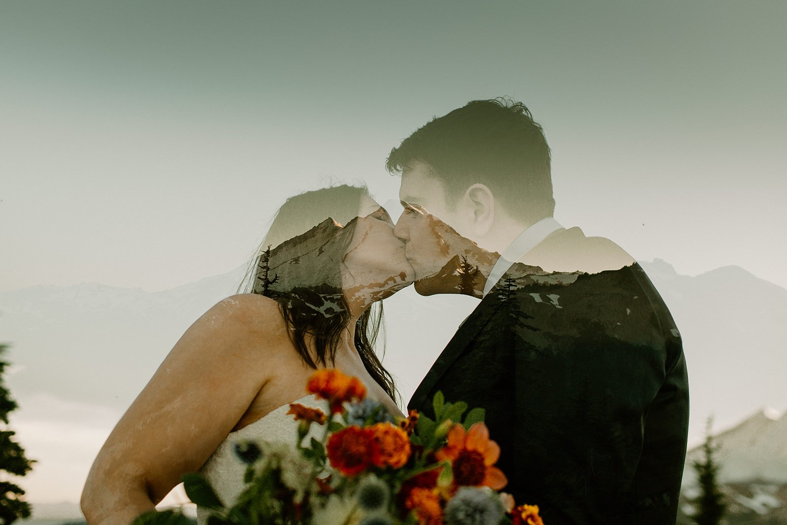 double exposure of couple kissing in front of a mountain in the north cascades in washington