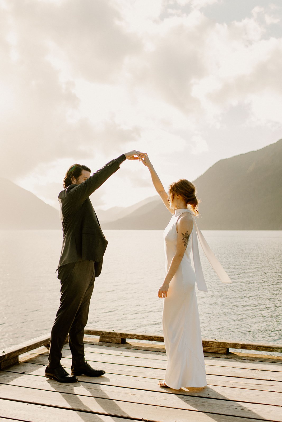 Bride and Groom dancing on the dock at Lake Crescent in Olympic NP