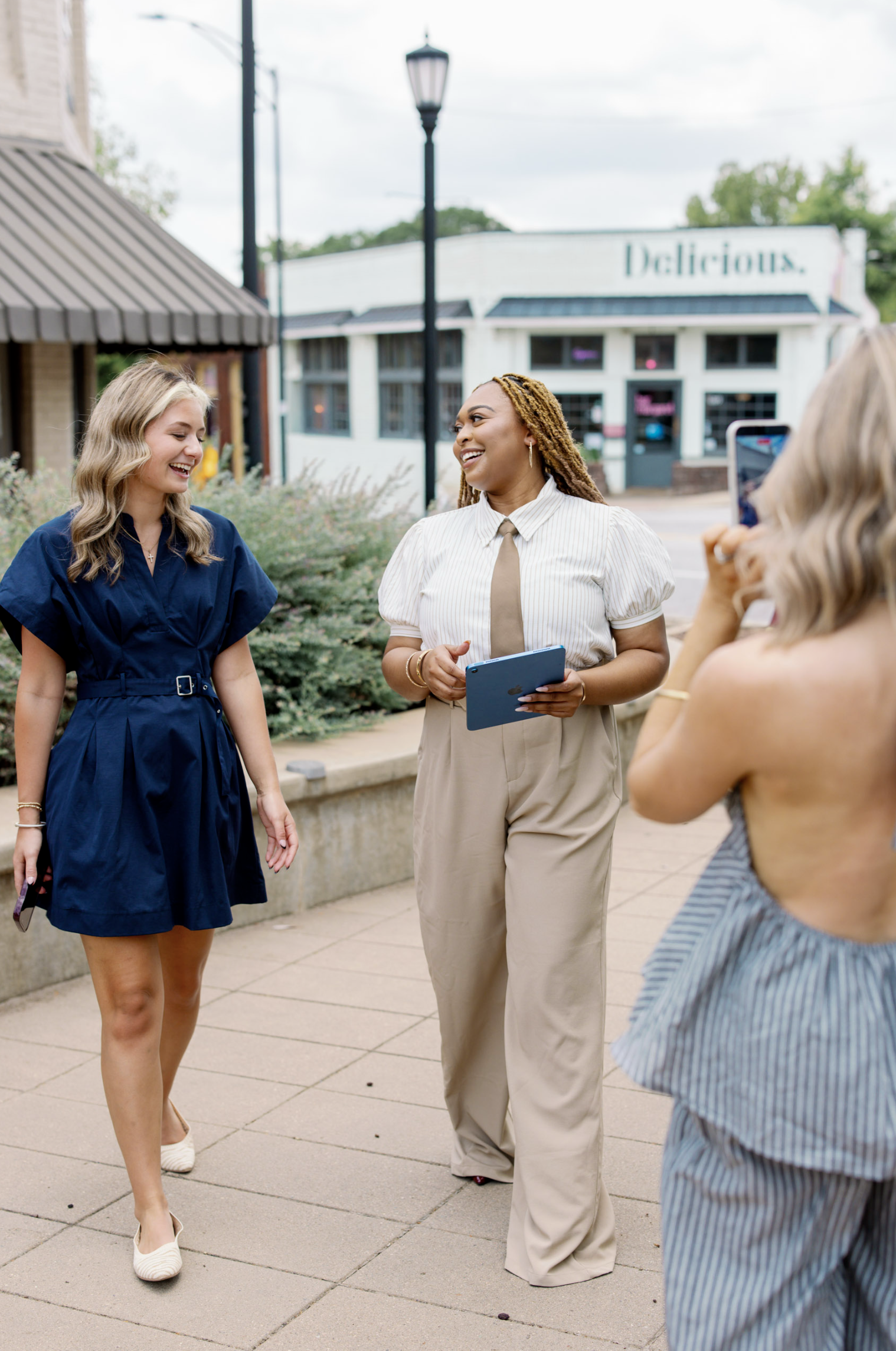 Three women walking outdoors and talking for a branding session in Greenville, SC by Melissa Glynn Photography