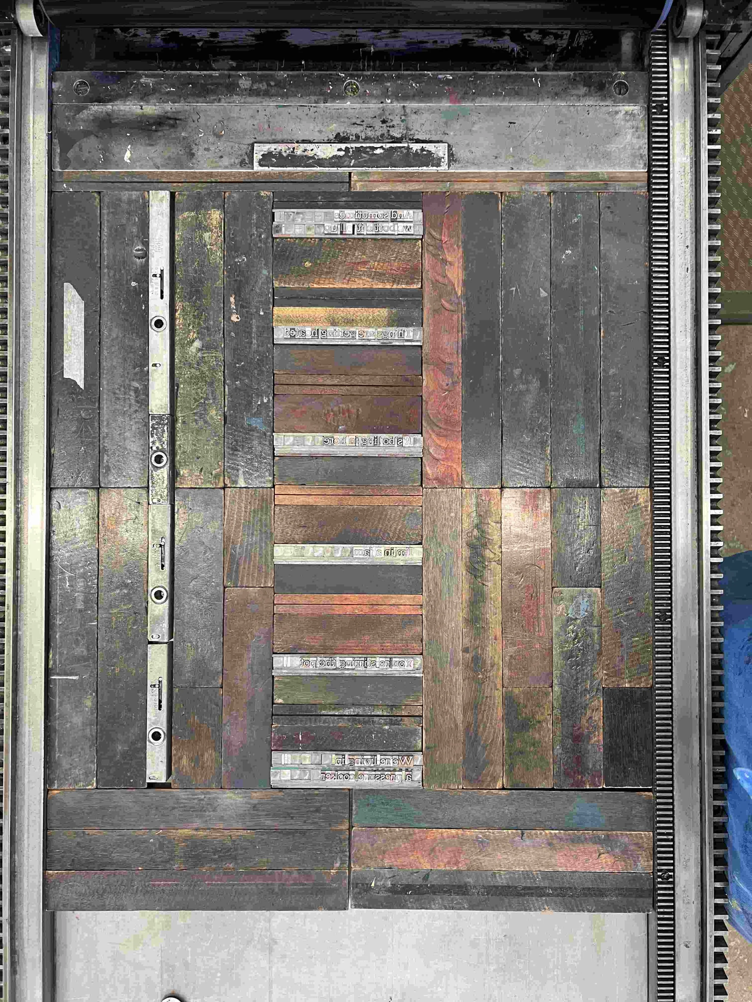 image of letterpress "makeready" or the pieces laid on the table to print phrases