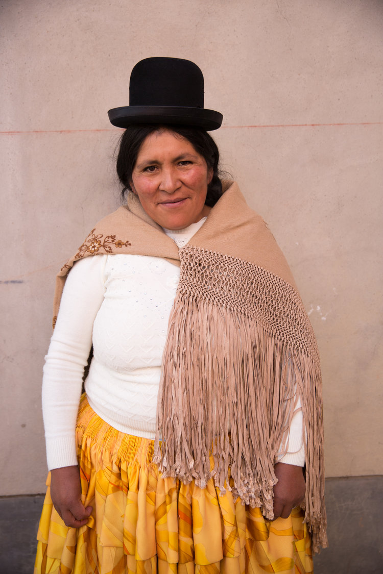 Meet artisan Ana Quea. Often the color combinations of the artisans outfits incredibly inspiring. We incorporate and use of the rayon tape yarn that the artisans macramé their shawls from within some of our ELEVEN SIX pieces.
