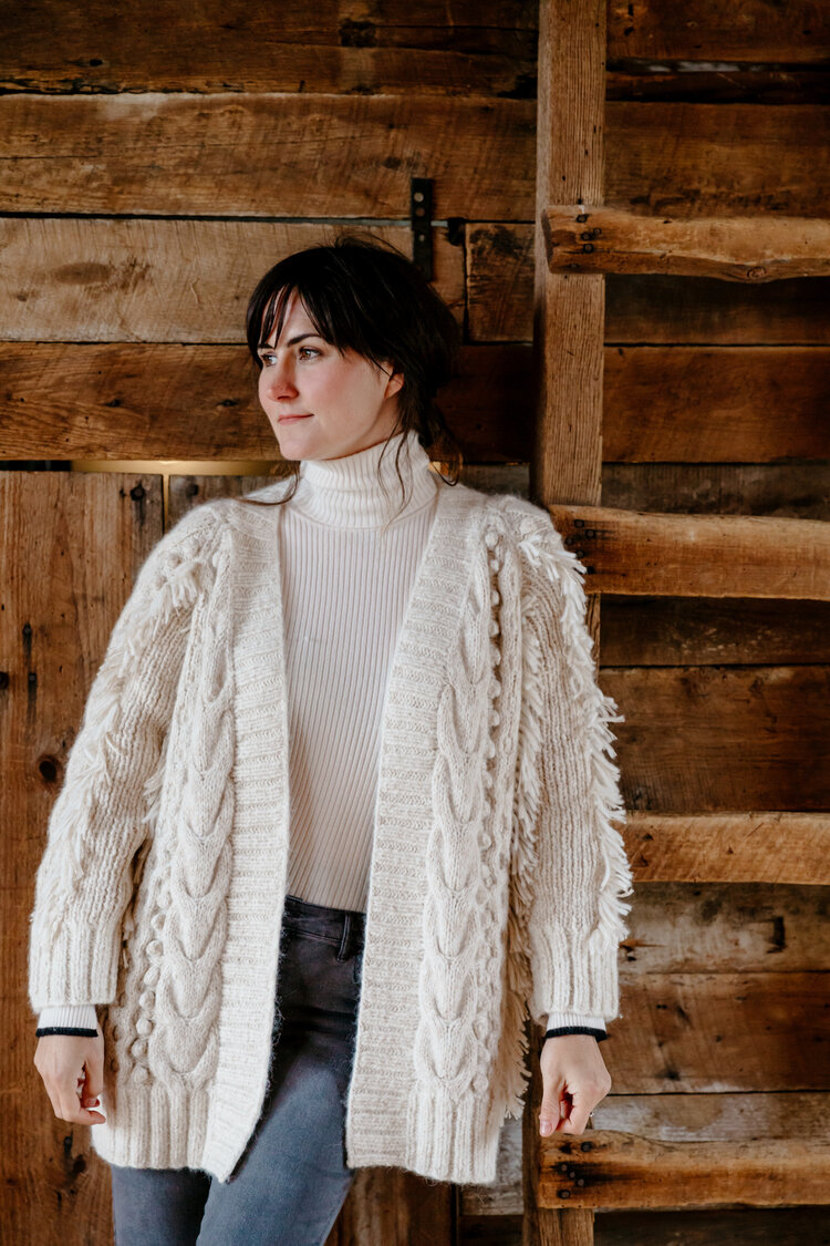 Dana wears Fall 19 Ella cardi in Nude tweed layered over our Edie T-neck sweater in Ivory