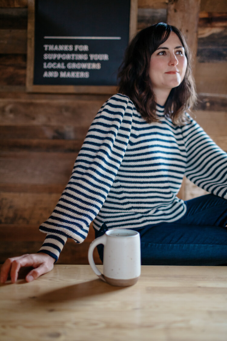 Dana wearing Fall 19 Mia sweater in stripe with Lail Design ceramic coffee mug