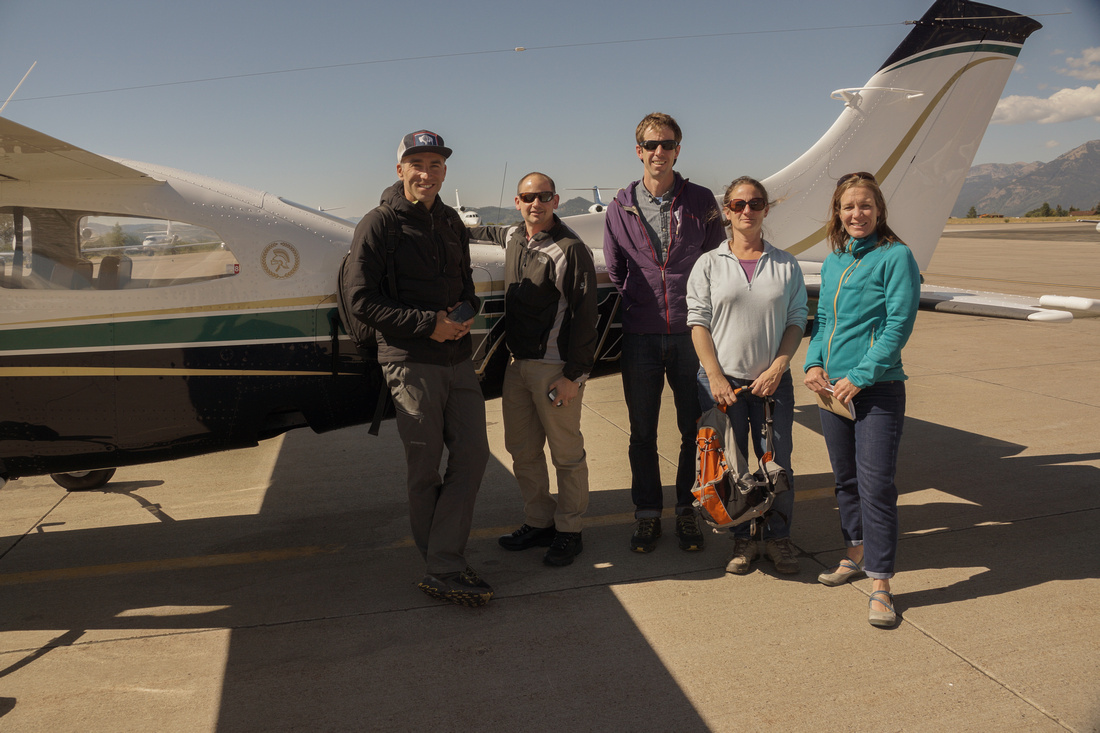 Preparing for takeoff. GYC's Kathy Rinaldi (right, blue jacket) and Pat Kearney (middle, purple jacket) flew over the Palisades recently with EcoFlight. (Photo EcoFlight.)