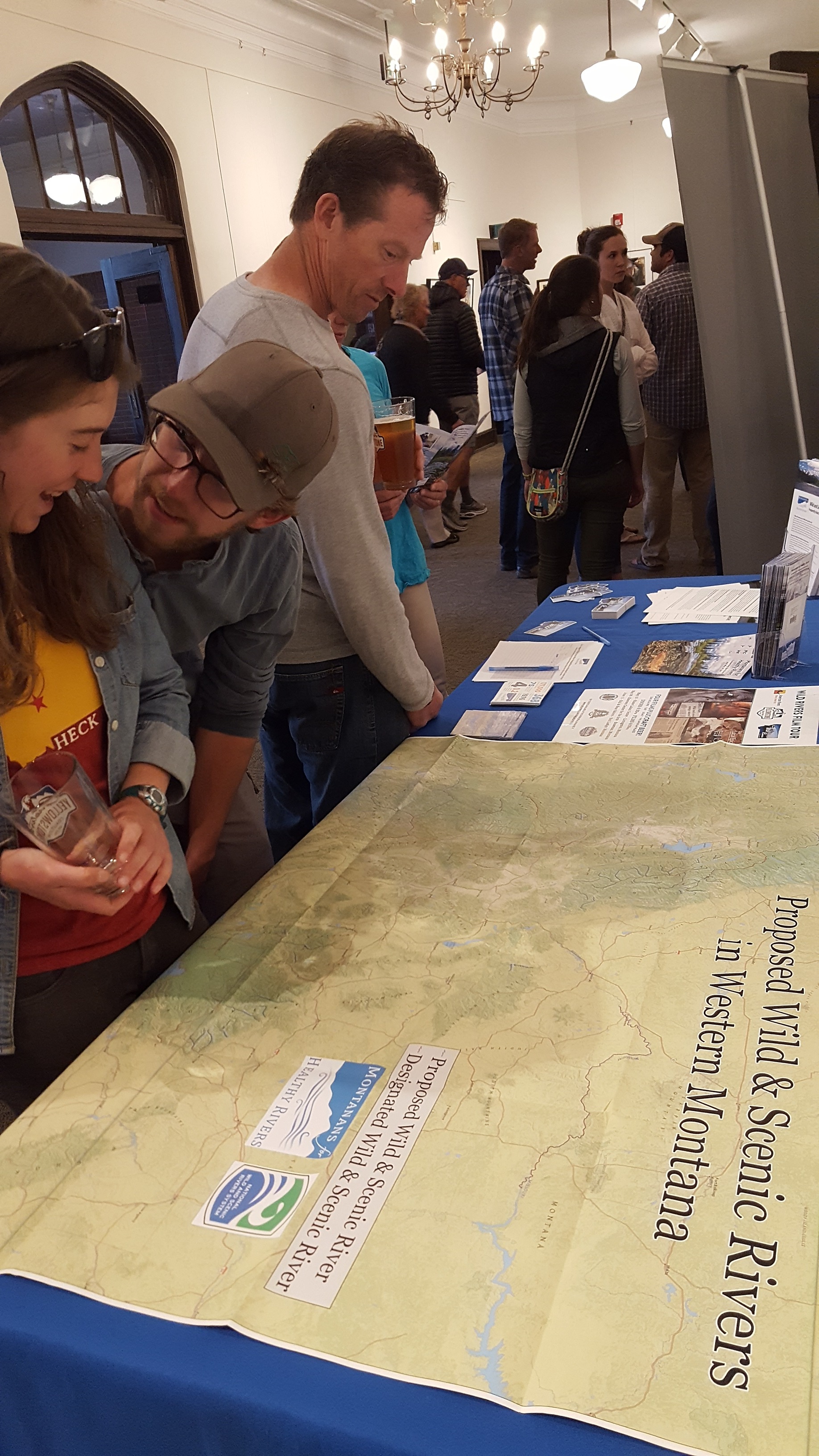 Filmgoers at our May 26 Wild Rivers Film Tour have a look at the map of rivers we're working to protect in southwest Montana. You can help - make your voice heard and protect these rivers today! (Photo GYC.)