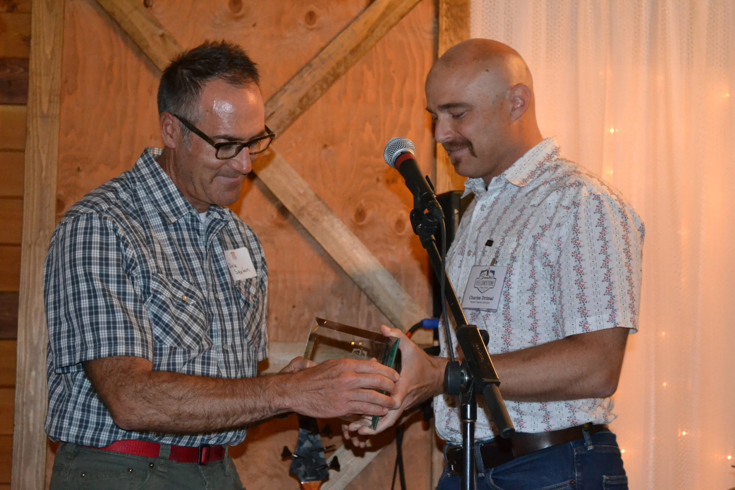 Charles Wolf Drimal of GYC (right) gives Dale Sexton the Grassroots Activism Award. (Photo courtesy GYC.)
