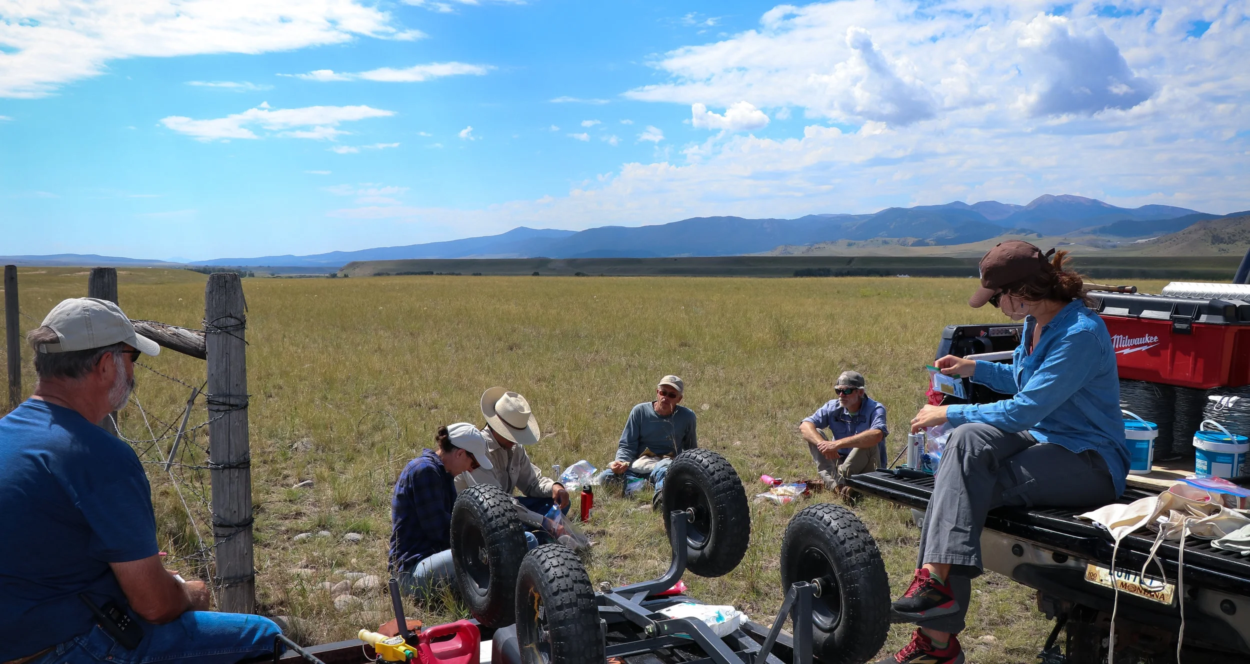 The crew eats lunch after a long morning of removing barbed wire. (Photo GYC/Emmy Reed.)