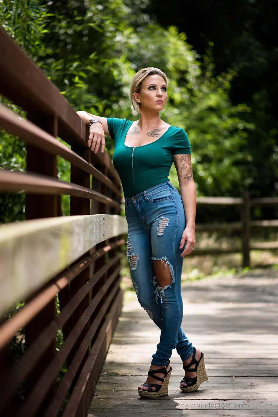 Image taken in shade with sun behind Krysta and lit with 36" Softlighter umbrella and single Godox V860n flash unit triggered by Yonguo YN622n HSS triggers. Lens: 85mm ISO: 200 Aperture: 1.8 Shutter: 1/2500