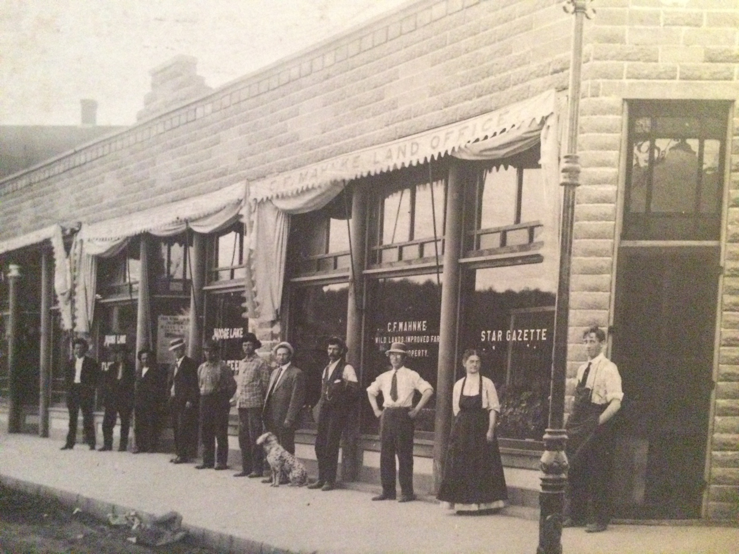 As a child, I was mesmerized by this photograph and even wrote a short fictional story about the staff at the newspaper. If you look closely, the window says "C.F. Mahnke," the name of my great-great grandfather. Sadly, I have no way to know which of the photographed gentlemen might be him. But if I had to guess, the short fellow with his hands on his hips feels familiar. 