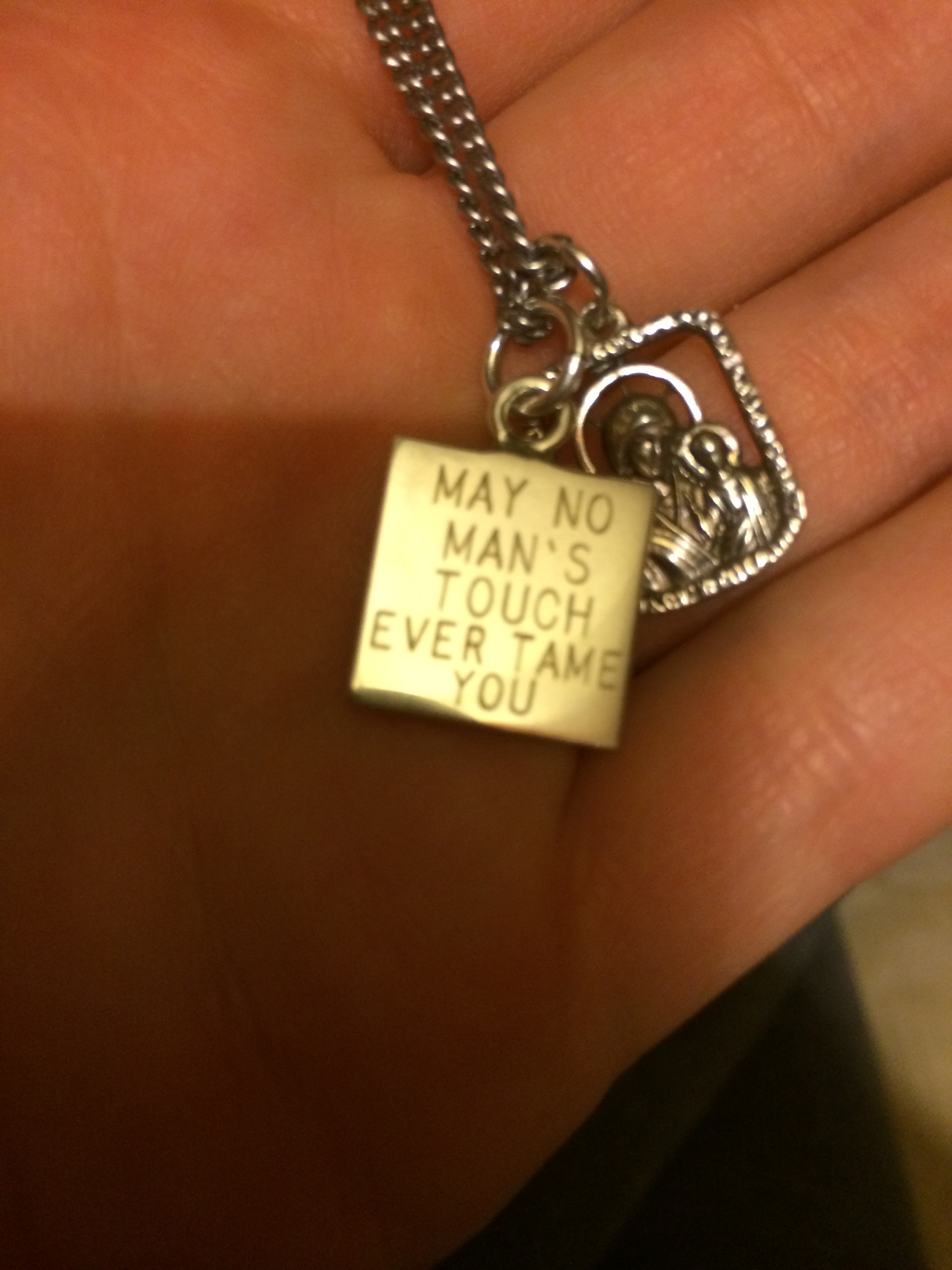  I also did strange things like make symbolic jewelry after breaking up with assholes who scared the bajeezus out of me. This necklace charm has a quote from a favorite Ray LaMontagne song of mine. 