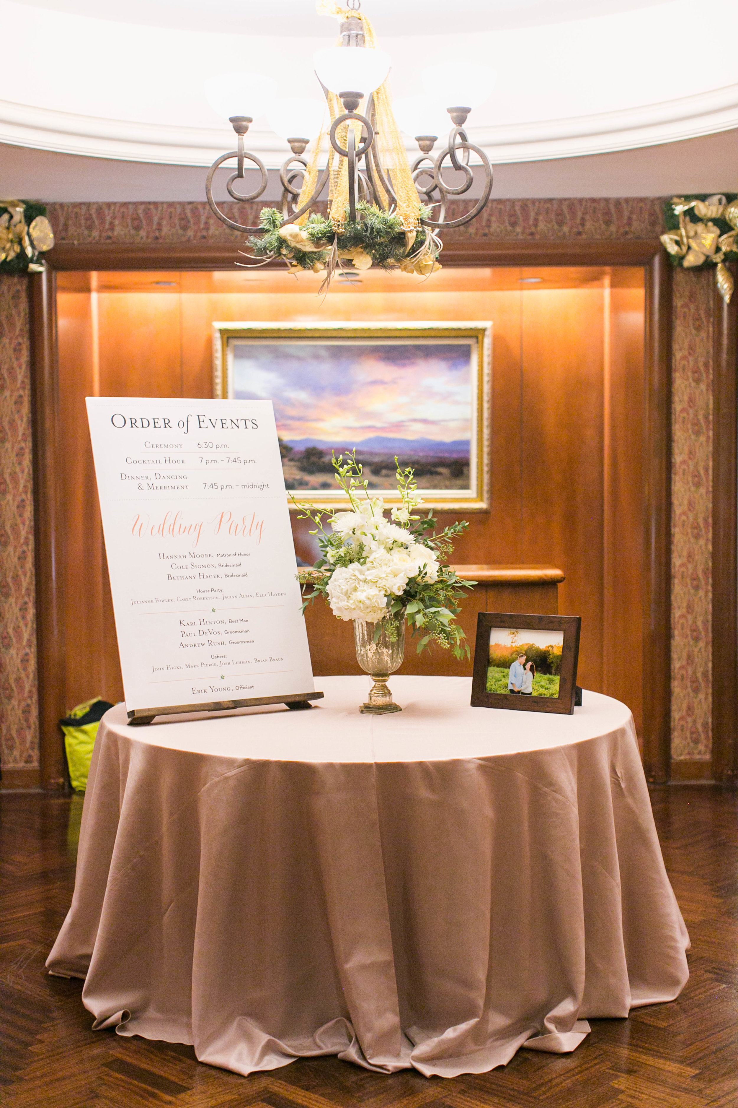  When people walked into the hall for the ceremony, they were greeted by this table with a poster-sized Order of Events, some flowers and a picture from our engagement shoot. 